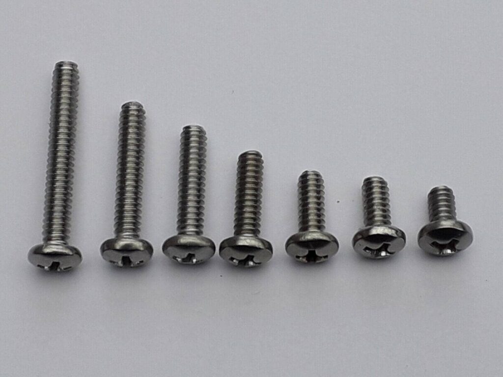 Which screws do I use to install the motherboard onto the standoffs